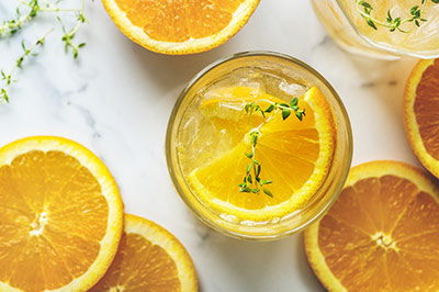 Aerial angle of an antioxidant beverage with orange slices